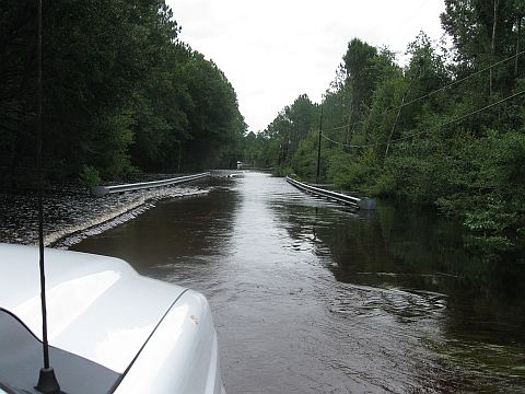 Never drive down a road that is covered with flood waters.